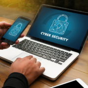 mobile phone and laptop with cybersecurity on it