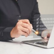 Man works on laptop on password policy strategy