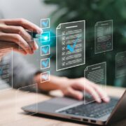 Person organizing service accounts on laptop